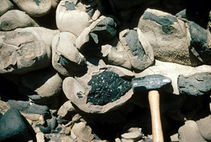 Dense tufa coating volcanic cobbles